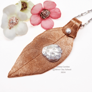 Copper Clay pendant with riveted Silver Clay detail