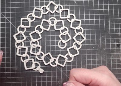 Preparing the silver clay chain for the kiln